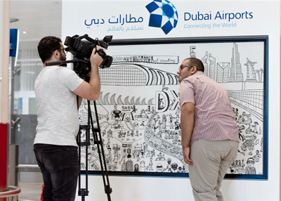 معرض فني في مطار دبي لرسومات أصحاب الهمم